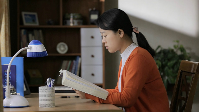 a girl is reading seriously