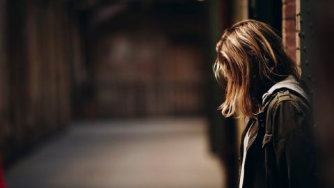 A woman feel sad in the dark