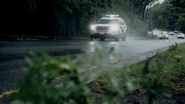 Police car driving on the road