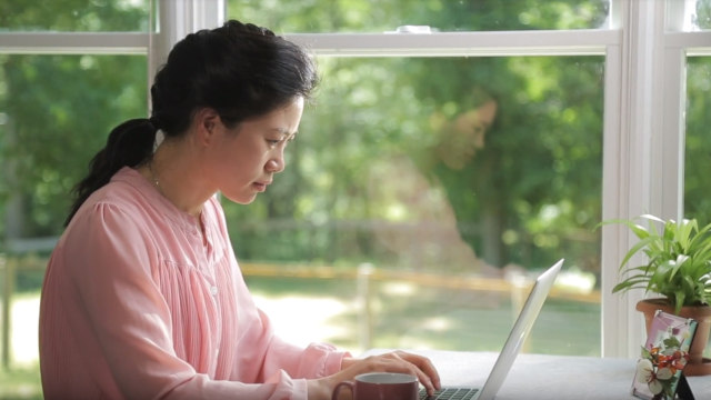 Christian watching computer